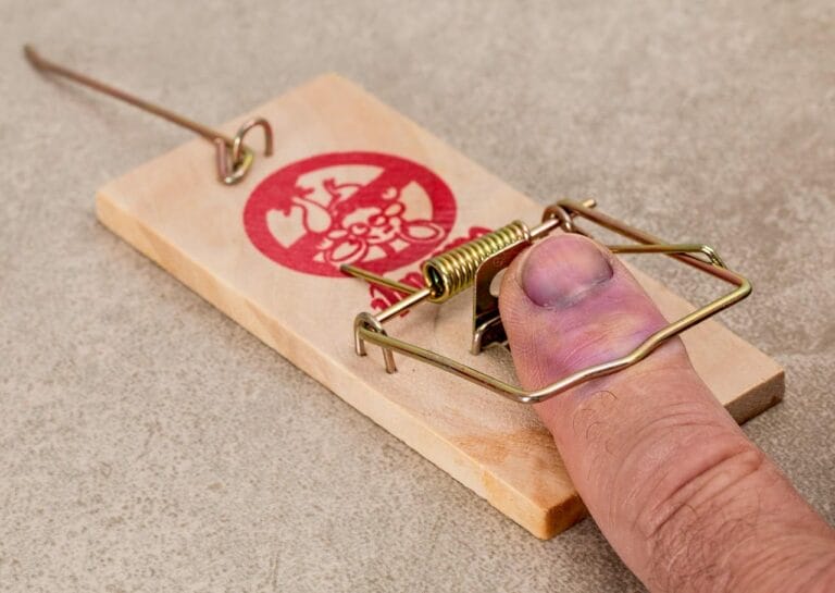 A finger caught in a mousetrap