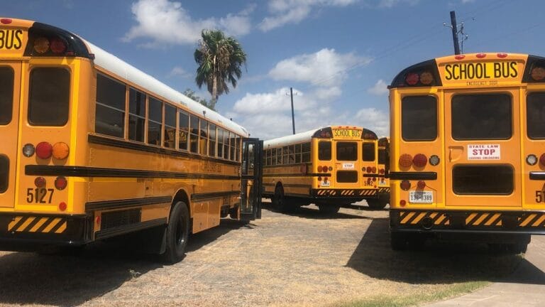 Four parked school buses