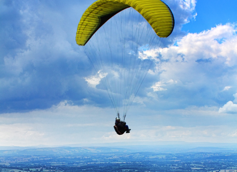 therapist flying with yellow parachute